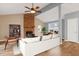 Bright and airy living room featuring a brick fireplace, hardwood floors, and lots of natural light at 1225 Kilmory Dr, Cary, NC 27511