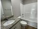 Bathroom with granite countertop and a tub shower combo at 125 Hydrangea Ln, Benson, NC 27504