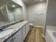 Main bathroom with double vanity and granite countertop at 125 Hydrangea Ln, Benson, NC 27504