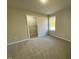 Bright bedroom with carpet flooring and walk-in closet at 125 Hydrangea Ln, Benson, NC 27504
