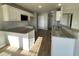Kitchen island with granite countertop and white cabinets at 125 Hydrangea Ln, Benson, NC 27504