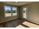 Bright office with large windows and wood-look flooring at 125 Hydrangea Ln, Benson, NC 27504