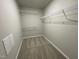 Large walk-in closet with wire shelving and carpeted floor at 125 Hydrangea Ln, Benson, NC 27504