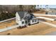 Aerial view of a two-story house featuring a well-manicured lawn and fenced-in yard at 128 S Clearbrook Ct, Angier, NC 27501