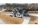 Beautifully landscaped property with a spacious yard, long driveway, and meticulously maintained two-story home at 128 S Clearbrook Ct, Angier, NC 27501