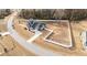 Expansive aerial view of a gray home with a white fence surrounding the property at 128 S Clearbrook Ct, Angier, NC 27501