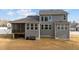 Back exterior highlighting the screened porch and multiple windows that flood the space with natural light at 128 S Clearbrook Ct, Angier, NC 27501