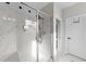 Beautifully tiled walk-in shower with a frameless glass door and a separate room for the toilet at 128 S Clearbrook Ct, Angier, NC 27501
