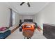 The main bedroom is bright and open with a decorative ceiling, seating and a window that brings in natural light at 128 S Clearbrook Ct, Angier, NC 27501