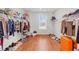 The walk-in closet has plenty of space and the window provides natural light while you organize your clothes at 128 S Clearbrook Ct, Angier, NC 27501