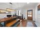 Dining room with hardwood floors, a unique chandelier, and a large wooden table at 128 S Clearbrook Ct, Angier, NC 27501