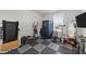 This home gym is spacious and well-equipped, featuring a variety of fitness equipment for a complete workout at 128 S Clearbrook Ct, Angier, NC 27501