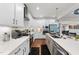 Bright kitchen featuring white cabinets, quartz countertops, and stainless steel appliances at 128 S Clearbrook Ct, Angier, NC 27501