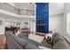 Spacious living room with fireplace feature and a large gray sectional at 128 S Clearbrook Ct, Angier, NC 27501