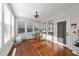Sunroom with hardwood floors, many windows, fan and door to the outside area to enjoy nature at 128 S Clearbrook Ct, Angier, NC 27501
