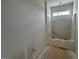 A full bathroom shows a tub and shower combo with sunlight filtering in from a transom window at 132 Tennyson Dr, Garner, NC 27529