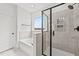 Bathroom with soaking tub, walk-in shower, and window at 132 Tennyson Dr, Garner, NC 27529