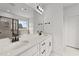 Double vanity bathroom with modern fixtures and a large mirror at 132 Tennyson Dr, Garner, NC 27529