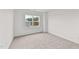 Bright bedroom with carpeted floor and large window at 132 Tennyson Dr, Garner, NC 27529