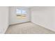 Bright bedroom with neutral carpeting and a large window at 132 Tennyson Dr, Garner, NC 27529