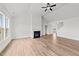 Spacious Gathering room with hardwood floors, fireplace and access to kitchen at 132 Tennyson Dr, Garner, NC 27529