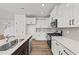 Modern kitchen with white cabinets, stainless steel appliances, and an island at 132 Tennyson Dr, Garner, NC 27529