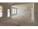 Spacious living room featuring large windows, high ceilings, and an open layout at 132 Tennyson Dr, Garner, NC 27529