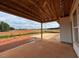 A covered patio space overlooks the backyard and neighboring land, providing an outdoor living area at 132 Tennyson Dr, Garner, NC 27529