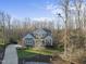 Two-story house on a wooded lot with a driveway at 148 Hidden Creek Ct, Pittsboro, NC 27312