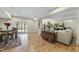 Spacious finished basement with a large sectional sofa, a dining area, and hardwood floors at 148 Hidden Creek Ct, Pittsboro, NC 27312