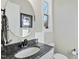 Bathroom with granite vanity, round mirror, and window at 148 Hidden Creek Ct, Pittsboro, NC 27312