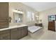 Luxurious bathroom with double vanity and soaking tub at 148 Hidden Creek Ct, Pittsboro, NC 27312