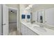 Bathroom with double vanity, granite countertop and view into bedroom at 148 Hidden Creek Ct, Pittsboro, NC 27312