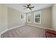 Well-lit bedroom featuring neutral walls and carpet at 148 Hidden Creek Ct, Pittsboro, NC 27312