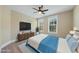 Bedroom with large TV, ceiling fan, and full-size bed at 148 Hidden Creek Ct, Pittsboro, NC 27312