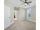 Bedroom with ceiling fan and view into another room at 148 Hidden Creek Ct, Pittsboro, NC 27312