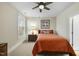Cozy bedroom with ceiling fan and large window at 148 Hidden Creek Ct, Pittsboro, NC 27312