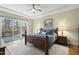 Spacious primary bedroom with private deck access at 148 Hidden Creek Ct, Pittsboro, NC 27312