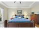 Bright bedroom with a large bed and access to a deck at 148 Hidden Creek Ct, Pittsboro, NC 27312