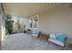 Covered patio with seating and wooded views at 148 Hidden Creek Ct, Pittsboro, NC 27312