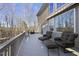 Large deck with seating and wooded views at 148 Hidden Creek Ct, Pittsboro, NC 27312