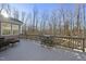 Deck with table and chairs, offering wooded views at 148 Hidden Creek Ct, Pittsboro, NC 27312