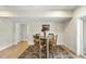 Basement dining area with a wooden table and chairs, and a patterned rug at 148 Hidden Creek Ct, Pittsboro, NC 27312