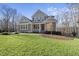 Two-story house with gray siding, white trim, and a front porch at 148 Hidden Creek Ct, Pittsboro, NC 27312