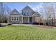 Two-story house with gray siding, white trim, and a front porch at 148 Hidden Creek Ct, Pittsboro, NC 27312