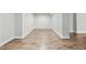 Long hallway with hardwood floors and white walls at 148 Hidden Creek Ct, Pittsboro, NC 27312