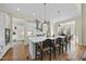 Open concept kitchen with large island, white cabinets and breakfast area at 148 Hidden Creek Ct, Pittsboro, NC 27312