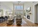 Living room with high ceilings, hardwood floors, and a fireplace at 148 Hidden Creek Ct, Pittsboro, NC 27312