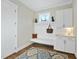 Convenient mudroom with built-in bench, hooks, and cabinets at 148 Hidden Creek Ct, Pittsboro, NC 27312
