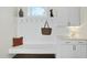 Clean mudroom features a built-in bench, hooks and storage at 148 Hidden Creek Ct, Pittsboro, NC 27312